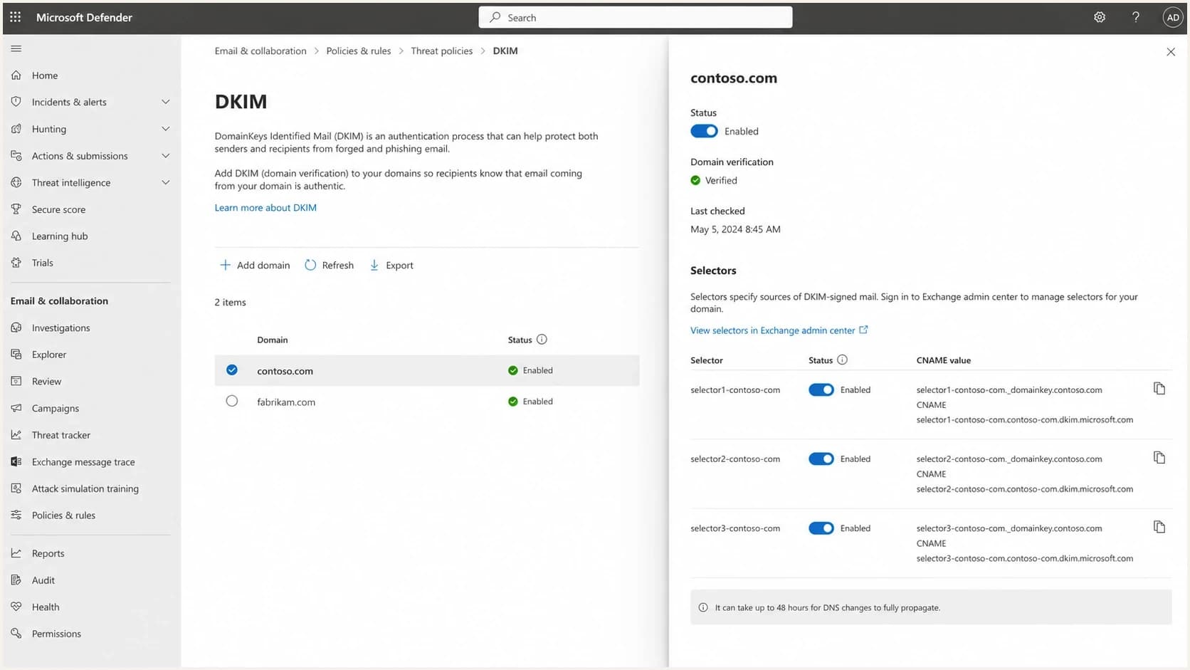 Microsoft Defender portal DKIM setup screen with domain selector status and CNAME values.