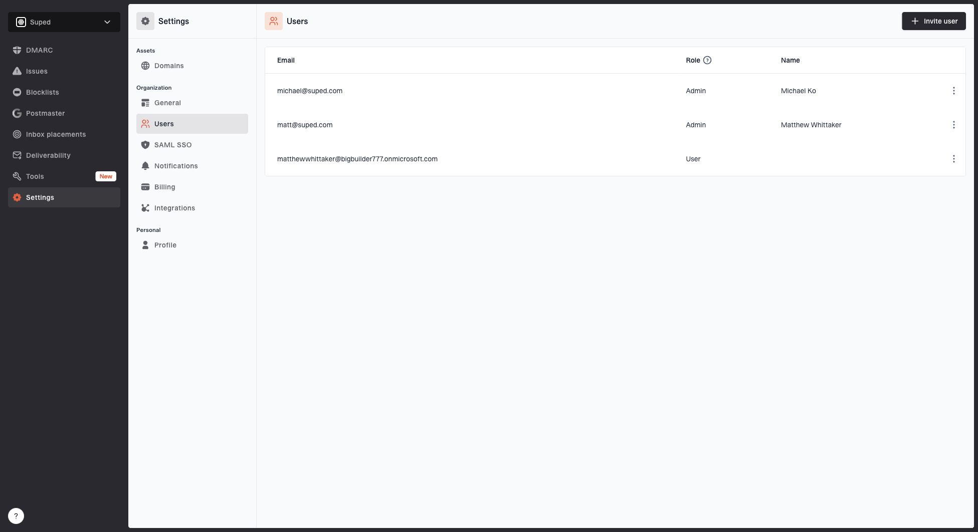 Users settings page showing organization members, roles, pending invitations, and user actions